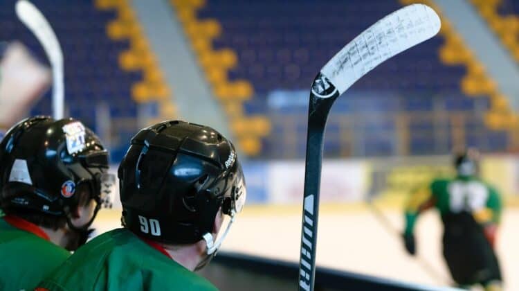 a guy holding a hockey stick