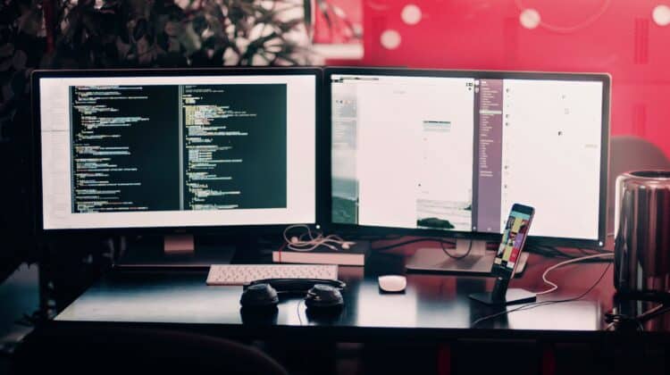 two black computer on black table