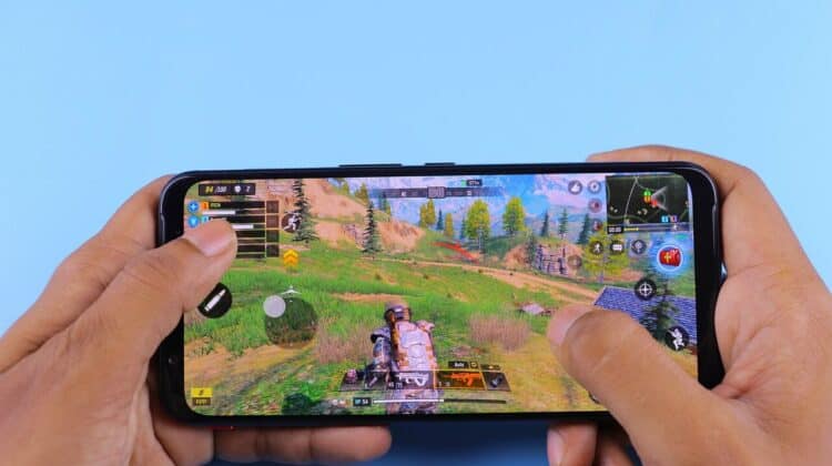 person holding an android phone showing game