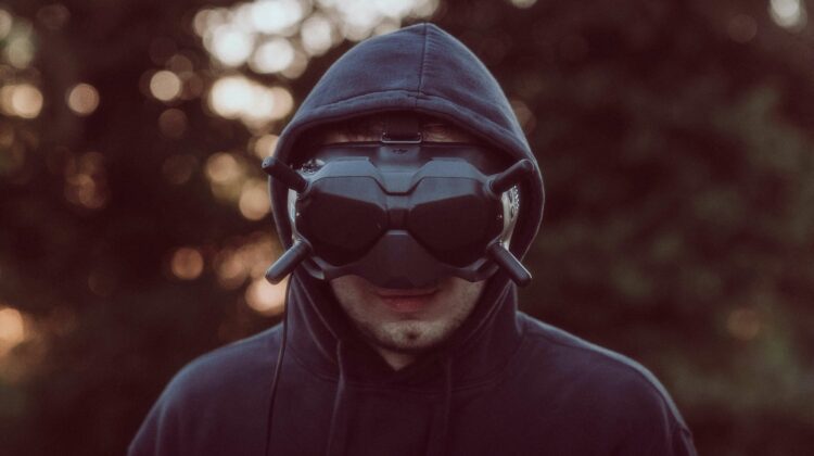 men wearing black hood and oculus